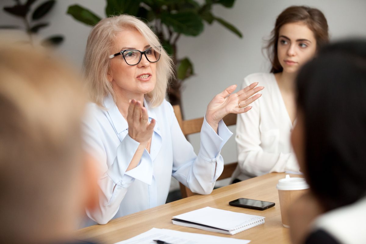 A broker walking two clients through their options